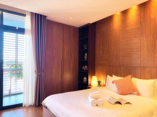 Postel nebo postele na pokoji v ubytování 9Trip Stay in Dalat Center Residence - 4 Star Service Apartment