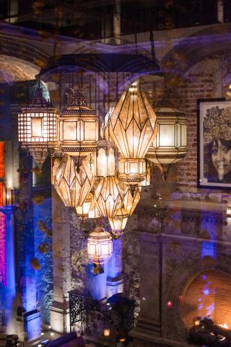 a large chandelier is hanging from a wall at Casa 1810 Hotel Boutique in San Miguel de Allende