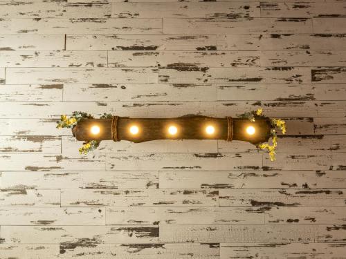 a string of lights hanging on a wall at BurgBnB Downtown in Harrisburg