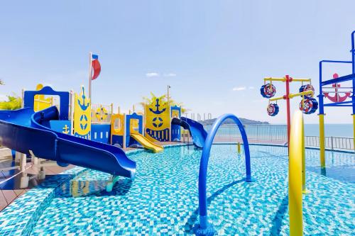 a water park with a water slide in a pool at Imperium Residence Kuantan in Kuantan