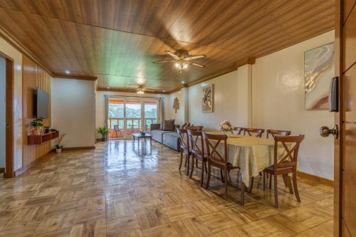 a dining room and living room with a table and chairs at Luxury Residence #3 - Second Floor in Baguio