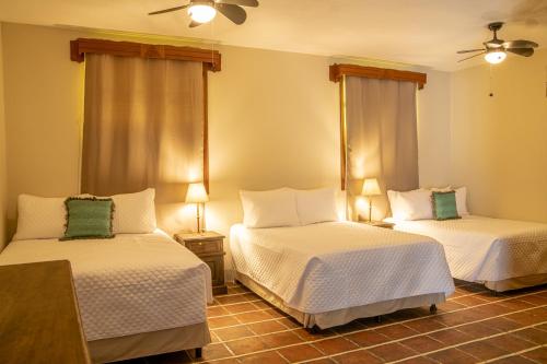 Postel nebo postele na pokoji v ubytování Hotel Casa Carmina by AHS