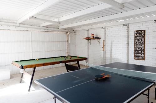 a ping pong table in a room with a ping pong ball at Rockpool Cape Paterson in Cape Paterson