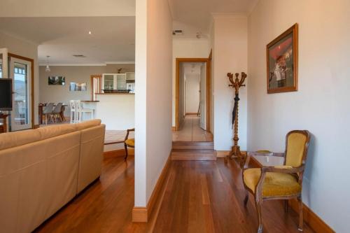 a living room with a couch and a table at Neve e Fiume Snow and River in Tawonga