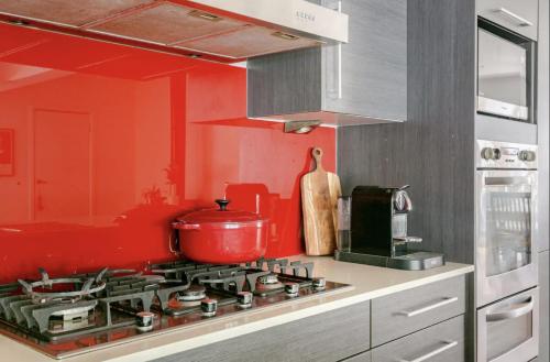 a kitchen with a stove with a pot on it at Newport Oases in Newport
