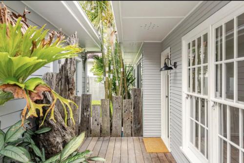 a porch with a wooden fence and plants at Newport Oases in Newport