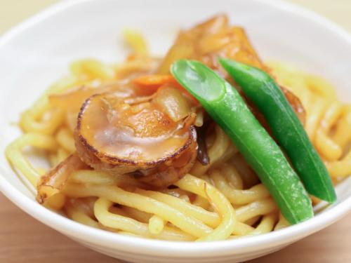 a bowl of food with pasta and green beans at Dormy Inn Wakkanai in Wakkanai