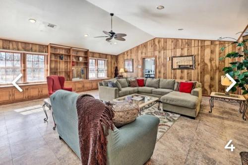 a living room with a couch and a table at Enjoyable Stay and Play Near Casino and Hospital in Pine Bluff