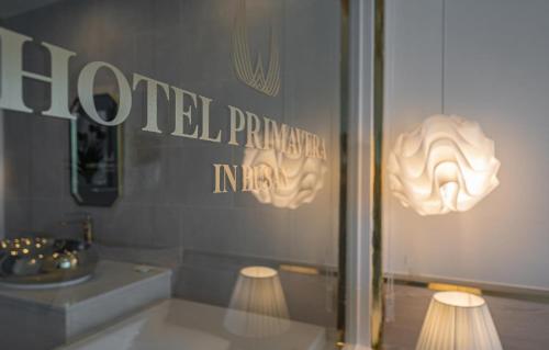a store display with two lights in a window at Gwangalli Hotel primavera in Busan in Busan