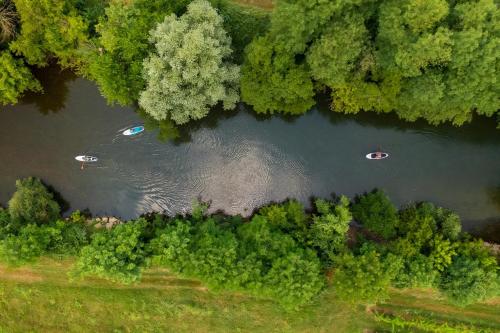 an overhead view of a river with two boats in it at Wellba Homestead Planina in Ajdovščina