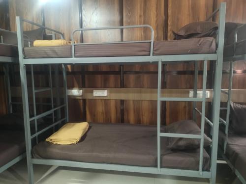 a couple of bunk beds in a room at Sun Bright Residency Badlapur in Badlapur