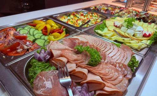 a buffet of different types of food on a table at Sarmata in Czyżówek