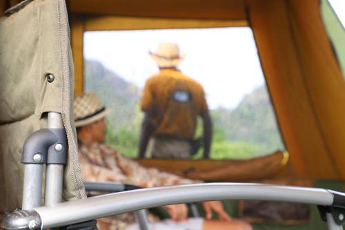 a view of a window with a picture of a man at Gal Oya Camping in Inginiyagala