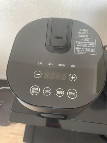 a computer monitor sitting on top of a machine at San-I 合浦公園 in Hanazonomachi