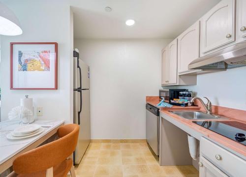 a kitchen with white cabinets and a counter top at Homewood Suites by Hilton East Rutherford - Meadowlands, NJ in East Rutherford