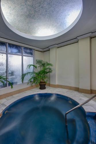 a large blue swimming pool in a room with a ceiling at Pearl Continental Hotel, Bhurban in Bhurban