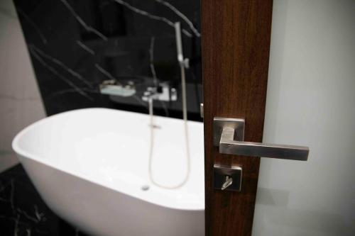 a bathroom with a sink and a white sink at Flat 1, spacious 3 bedroom near Beaches and Countryside in Mġarr