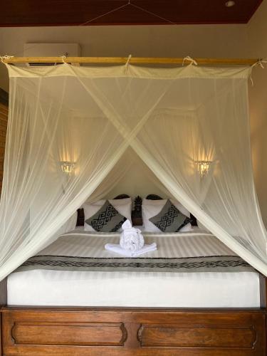 Letto o letti in una camera di Abian Ayu Villa
