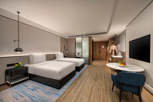 Postel nebo postele na pokoji v ubytování Crowne Plaza Sanya Yazhou Bay by IHG