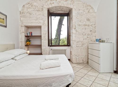 Postel nebo postele na pokoji v ubytování Torre Marinella