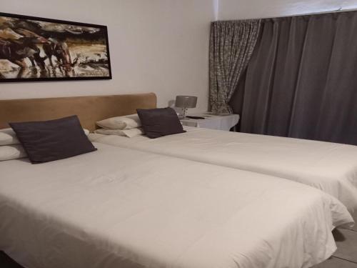 Katil atau katil-katil dalam bilik di Herb Garden Guesthouse