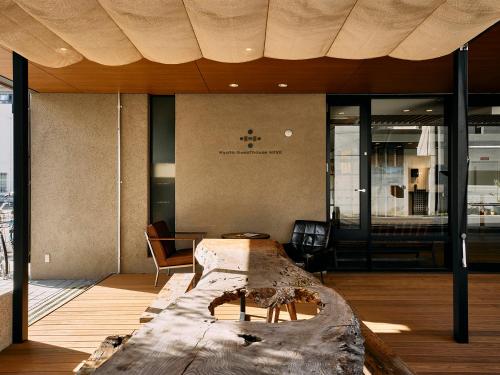 a room with a large bed in the middle of it at Kyoto Guesthouse HIVE in Kyoto