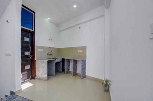 a room with a counter in the middle of a building at Hotel O Star Rest Hotel in Jaipur
