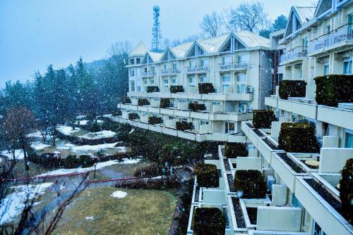 a view of a building in the snow at Pearl Continental Hotel, Bhurban in Bhurban