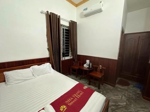 a bedroom with a large bed and a window at Nha Trang Homestay Đồng Nai in Tân Phú