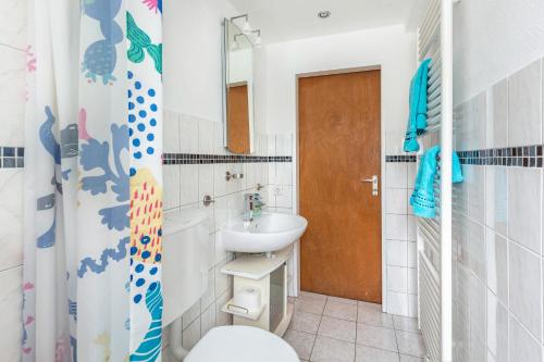 a bathroom with a sink and a toilet at Struthhof in Finsternthal
