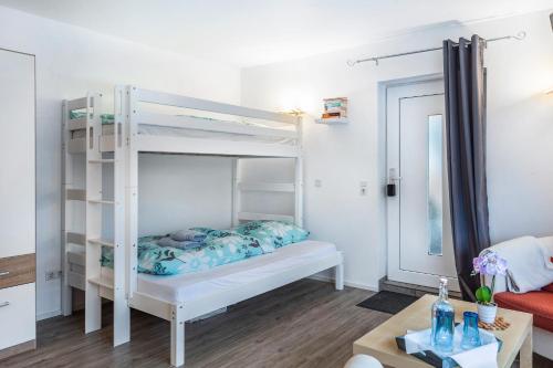Postel nebo postele na pokoji v ubytování Struthhof