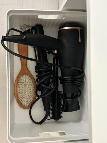 a drawer filled with various kitchen utensils at Sillim Leo's House in Seoul
