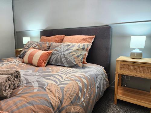 Ένα ή περισσότερα κρεβάτια σε δωμάτιο στο Beachfront Bliss Hervey Bay