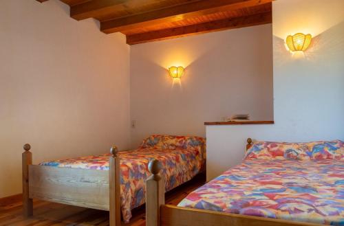 Ένα ή περισσότερα κρεβάτια σε δωμάτιο στο Gîte Gîtes de France 4/6 personnes B