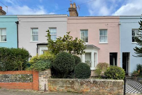 a house with a brick wall in front of it at Designer's Town House in Winchester