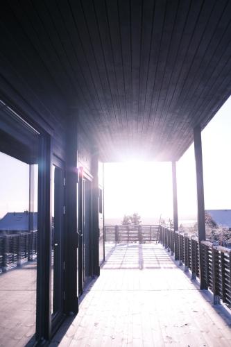 an empty building with the sun shining through the windows at Tupasvilla in Saariselka