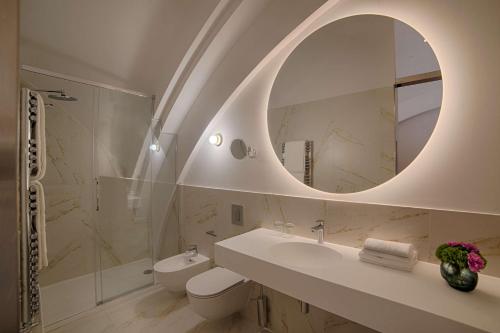 a bathroom with a sink and a mirror at NH Collection Milano CityLife in Milan