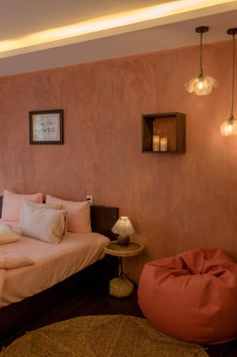 a hotel room with two beds and a table at Du De Homestay in Hoi An