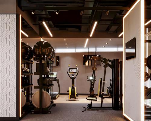 a gym with weights and exercise equipment in a room at Grand Millennium Business Bay in Dubai