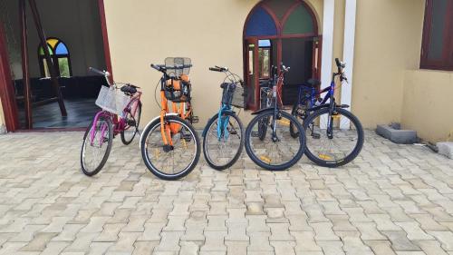 a group of bikes parked next to a building at Deshadan Chola , Thanjavur in Thanjāvūr