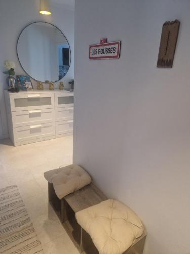 a bathroom with a sign that reads its house at Enjoy in Les Rousses