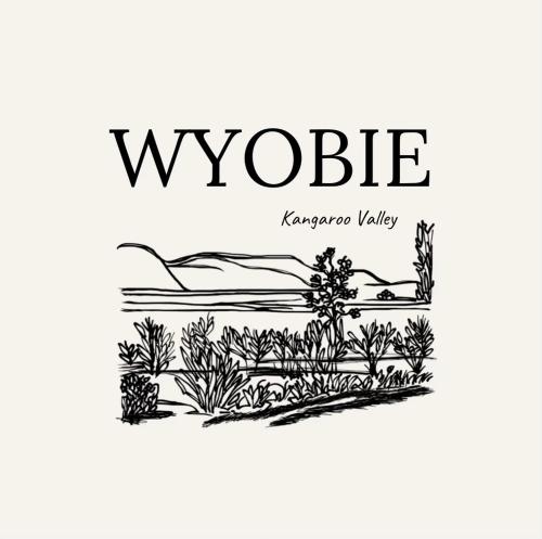a black and white logo for wookiekarma valley at Wyobie Kangaroo Valley Treehouse in Kangaroo Valley