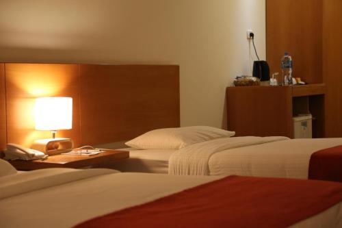 Una cama o camas en una habitación de Caesar Hotel Ramallah