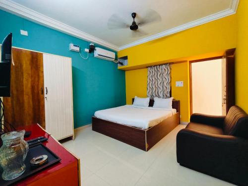 Postel nebo postele na pokoji v ubytování Dhanas Residency Auroville