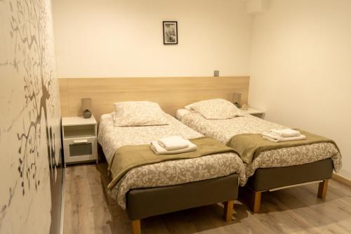 Katil atau katil-katil dalam bilik di Appartement 1-4 pers - Aéroport CDG, Parc Expo, Villepinte - A L'Ombre du Pin "9"
