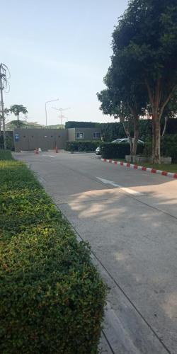 a street with orange and white cones on the road at Studio Seaview Jomtien floor12 23sqm in Jomtien Beach