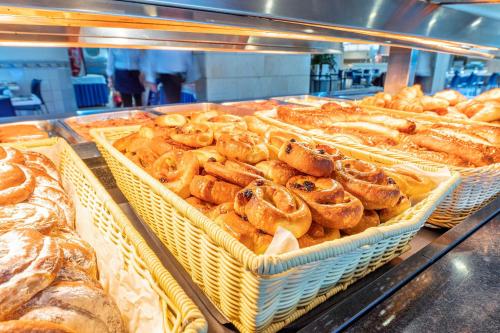 a display case in a bakery filled with lots of pastries at Port Fiesta Park in Benidorm