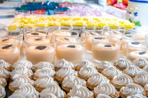 a display of cupcakes and candles on a table at Port Fiesta Park in Benidorm