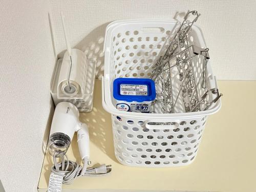a basket of utensils sitting on top of a counter at Discover Fukuoka House in Fukuoka