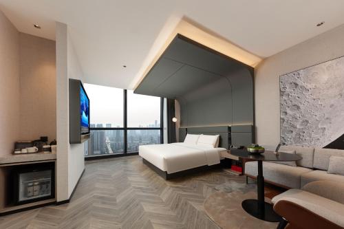 TV a/nebo společenská místnost v ubytování Atour S Hotel Wuhan Wuchang River Beach